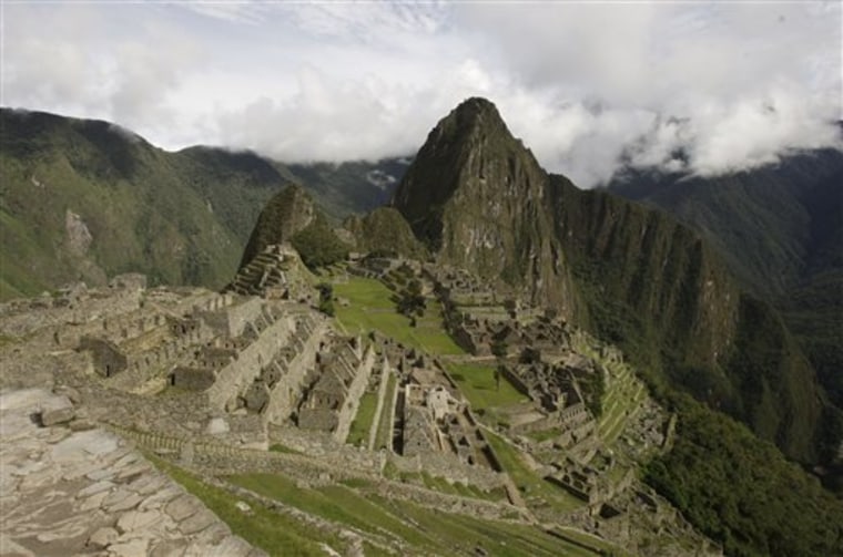 View of the Machu Picchu archeological site in Cuzco, Peru Friday, Jan. 29, 2010. Peruvian authorities are hoping to evacuate the last tourists stranded after heavy rains and mudslides in Peru blocked the train route to Machu Picchu, but the Inca citadel is likely to stay closed for weeks even if the weather improves.(AP Photo/Martin Mejia)